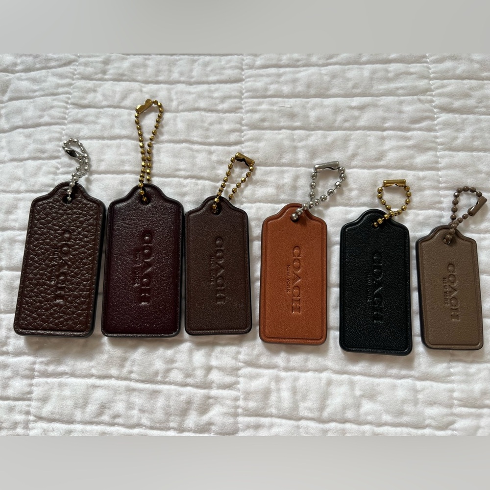Coach leather hangtags 
Black, maple, dark stone, Merlot, burnished Amber